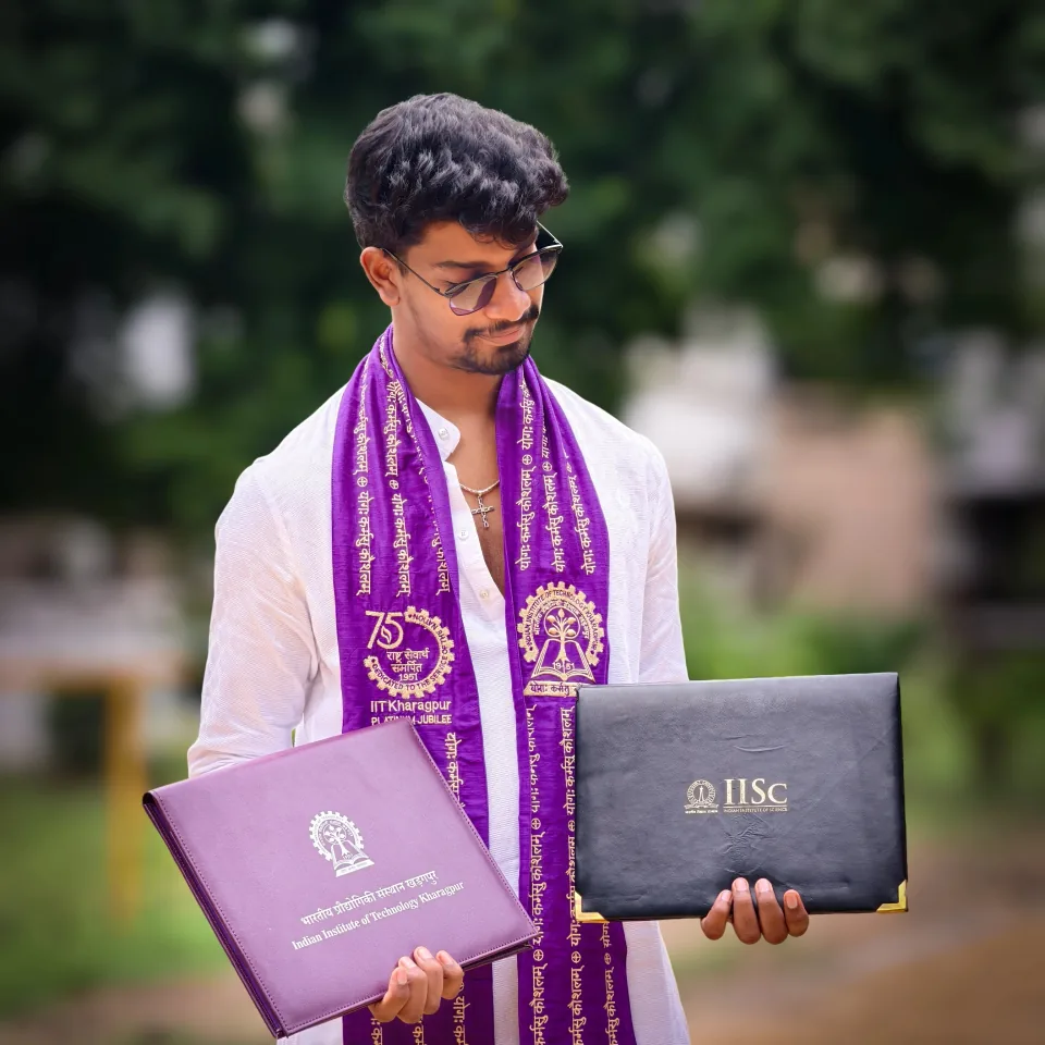 K Sree Roop holding IISc Bengaluru and IIT Kharagpur folders